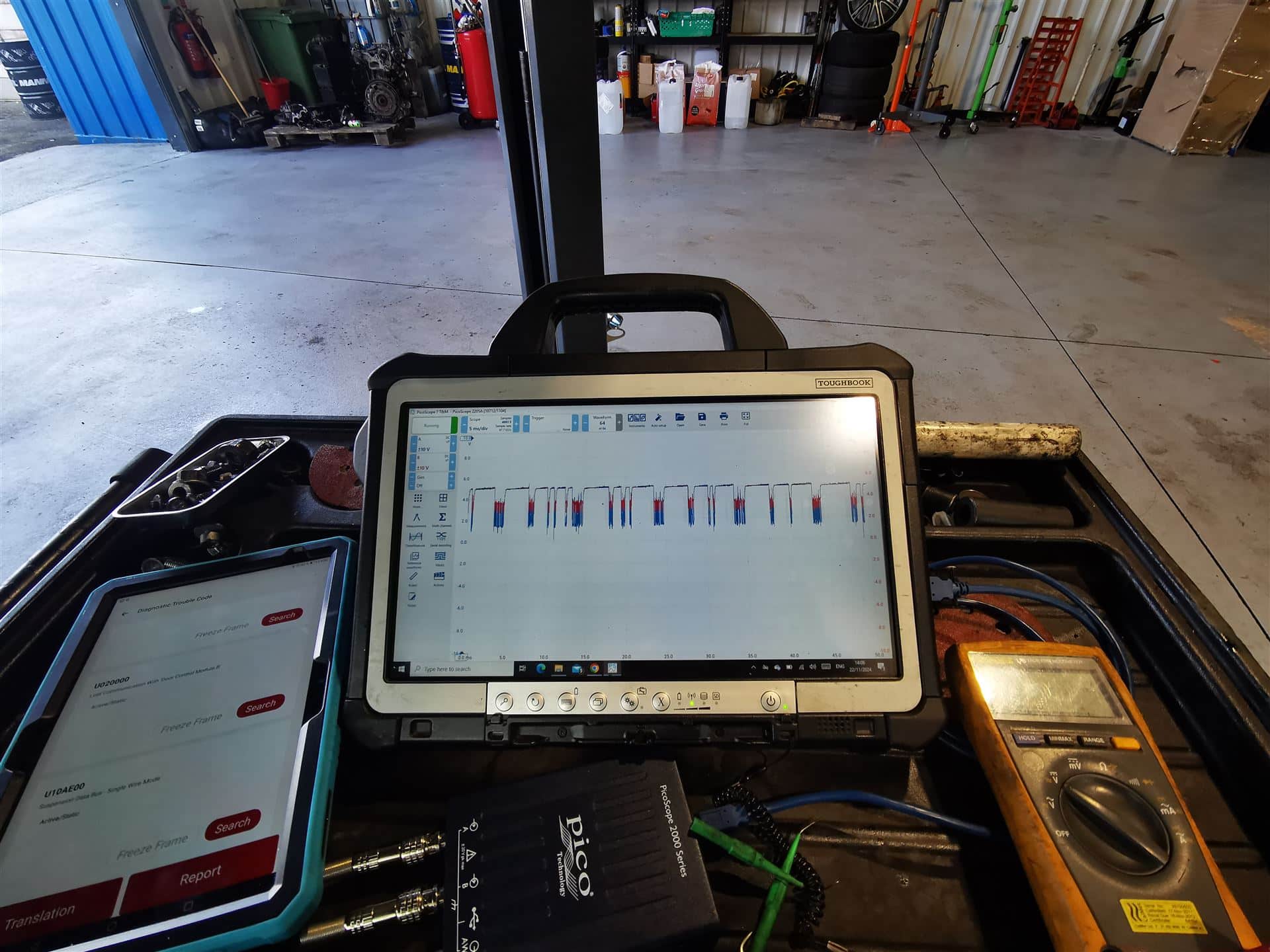 Professional EV diagnostic equipment displaying vehicle analysis data during electric vehicle testing